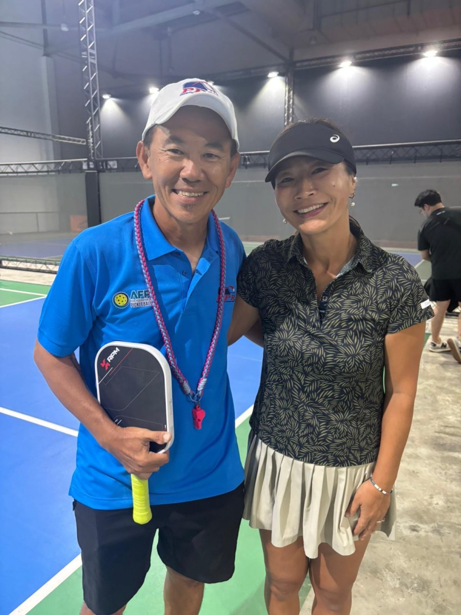 Coach Gary Tan courtside at a pickleball session in Singapore
